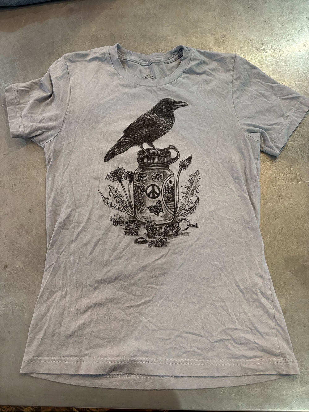 Loris Light Blue Tee with Black Raven & Jar Graphic